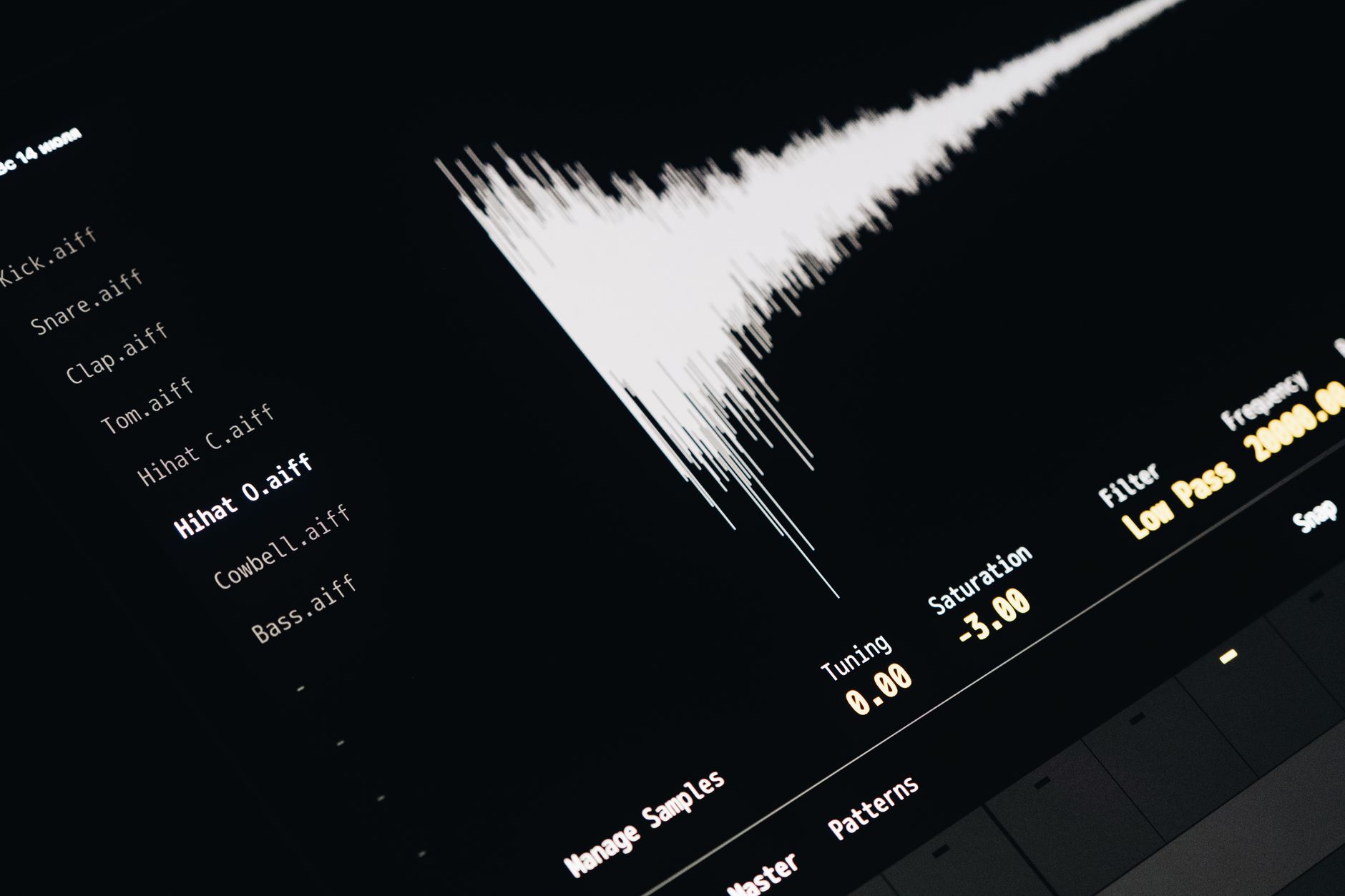 Close-up of hands editing an audio waveform on a laptop before a gig