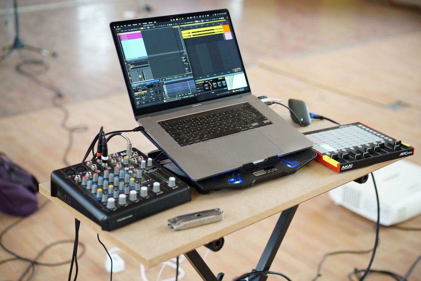 DJ software showing an analyzed waveform and beatgrid on a laptop screen