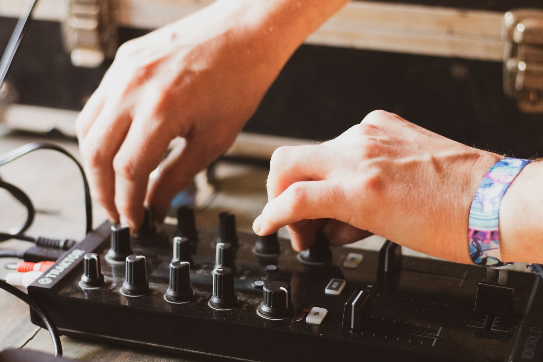 DJ reading the crowd while mixing between genres at an event